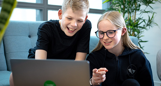 Students looking at a computer